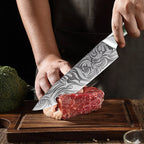 Damascus chef knife cutting steak and protein for meal prep